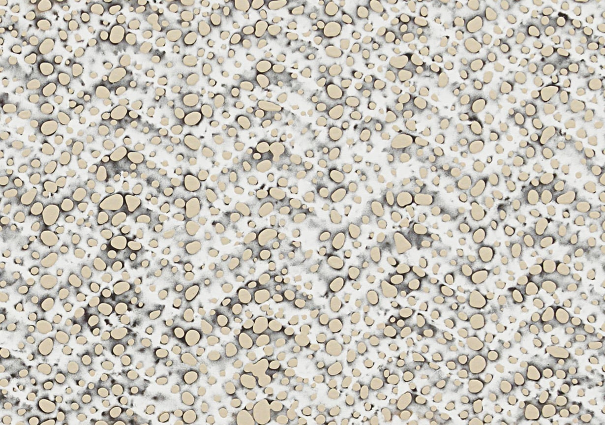 close up of knitted fabric pattern which also has little holes that look burnt in