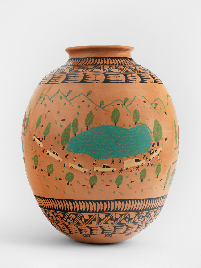 Clay pot with black patterns painted around its neck and bottom and mountain range with a lake within its middle part.