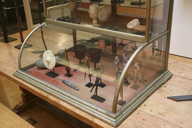 glass case containing objects