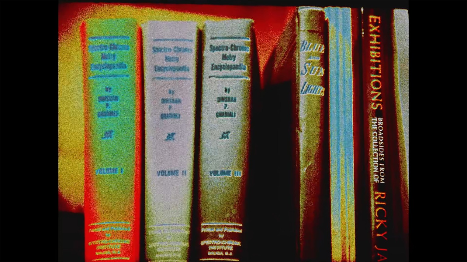 screenshot of a low-quality image of books
