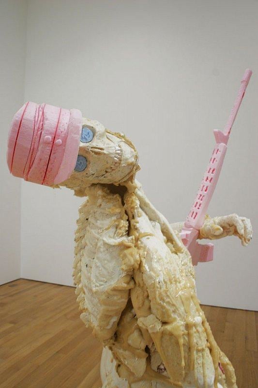 skeleton holding a pink rifle and wearing a pink soldier's hat