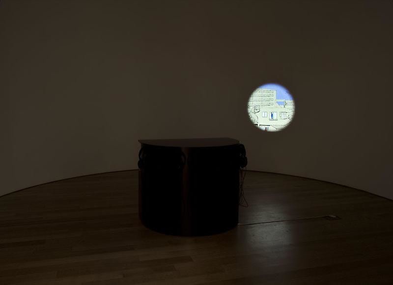 circle animated onto a wall revealing a city