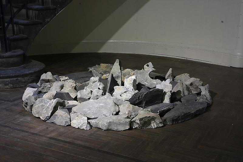 rocks on the floor piled together in a circle