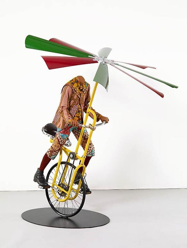 headless mannequin riding a flying machine