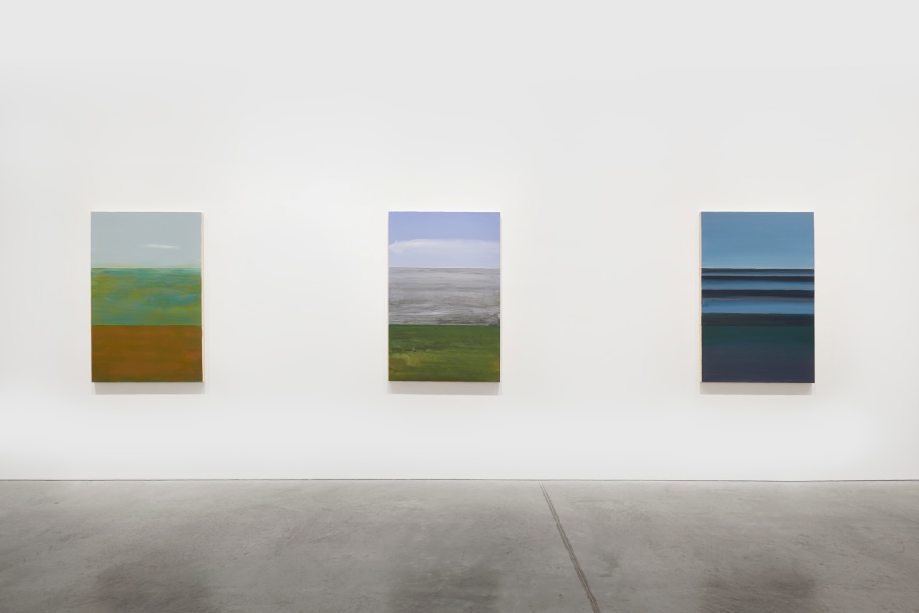 view of three paintings