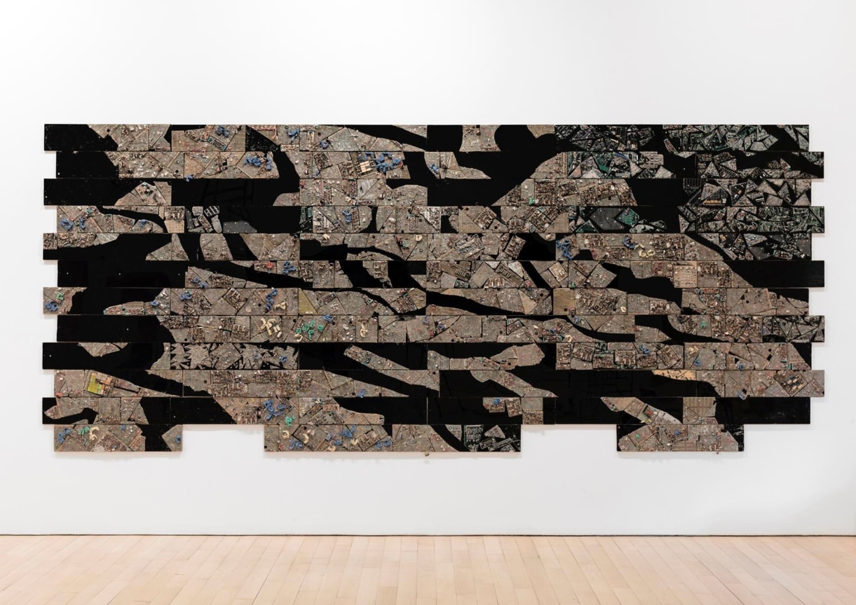 electrical wires and components put together to resemble a spliced map