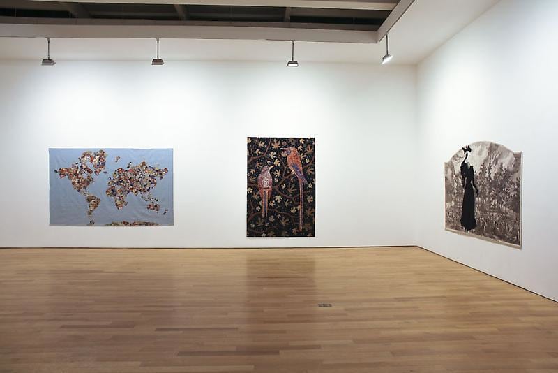 installation view of three tapestries