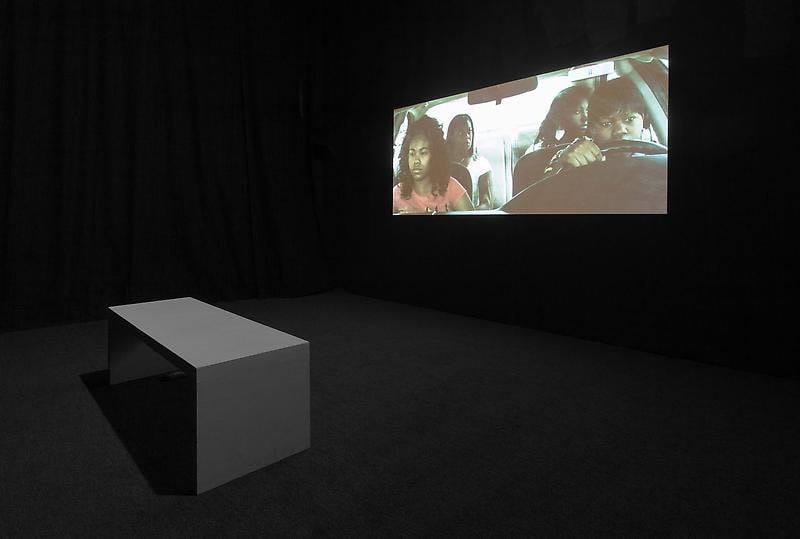dark gallery with a video projection