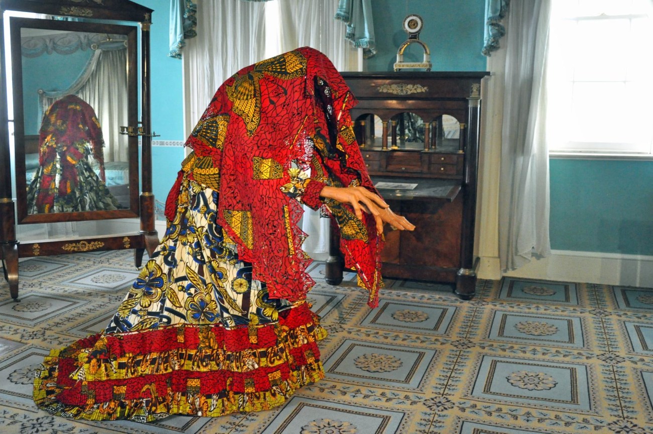 mannequin covered in a shall while maintaining a spooky pose