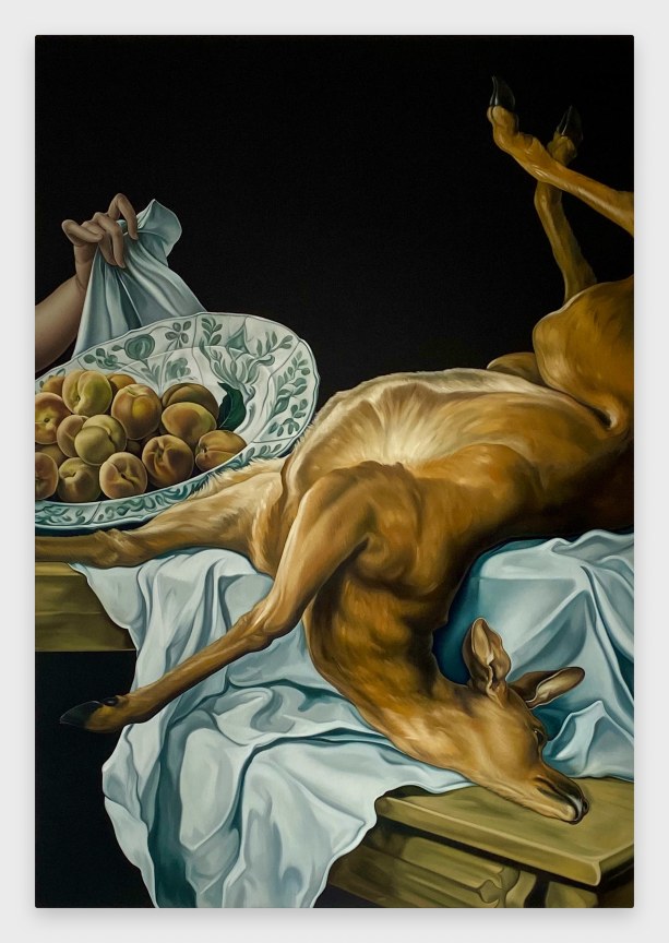 deer carcass and fruit displayed on a wooden table, covered in a white cloth, in a dark room