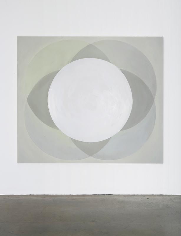 Abstract geometric painting with four intersecting circles dominated a yellowish grey canvas