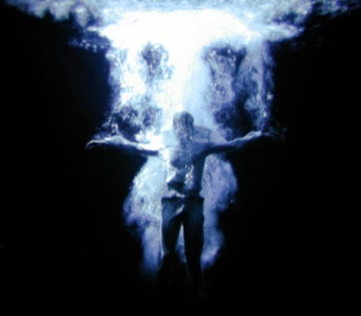 man submerging in water
