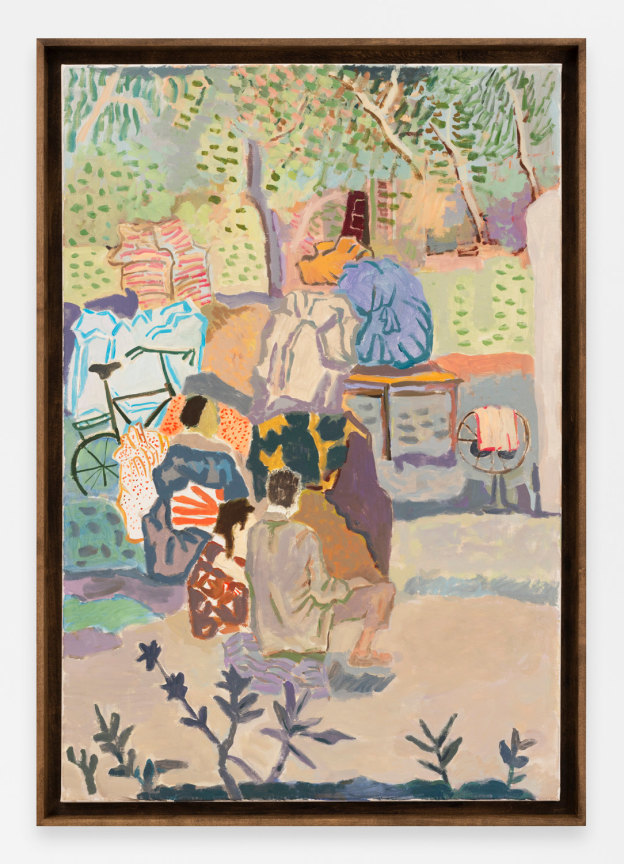 two people sitting outside with their back to the viewer, looking at a pile of personal items