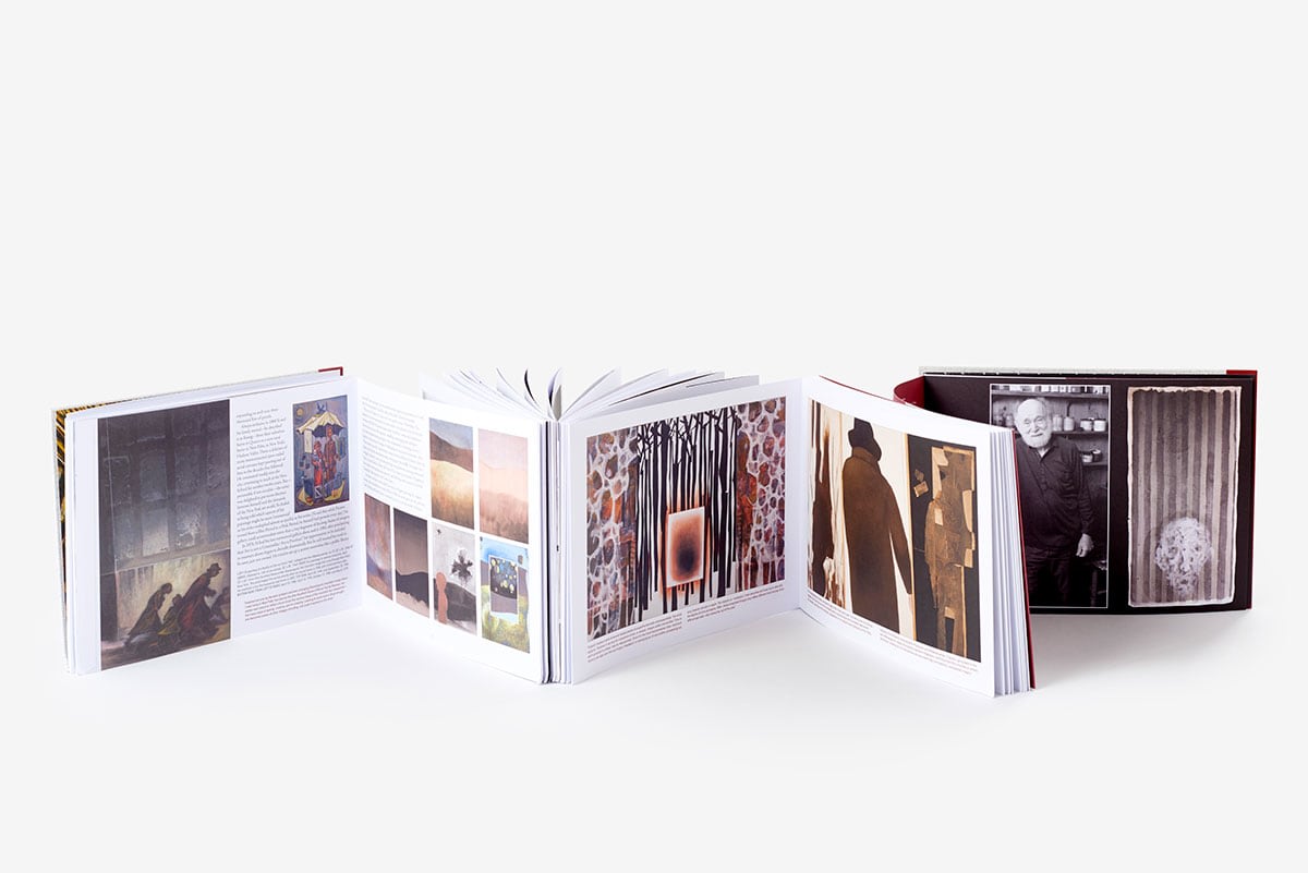 Image of an opened copy of the Si Lewen: The Parade catalog by Art Spiegelman.