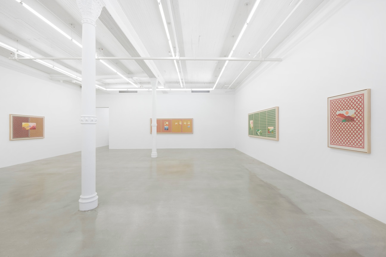 view of white gallery with four embroidered artworks