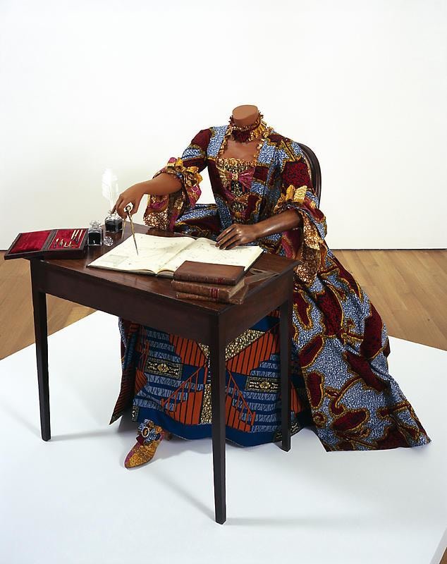 mannequin in a dress using a compass