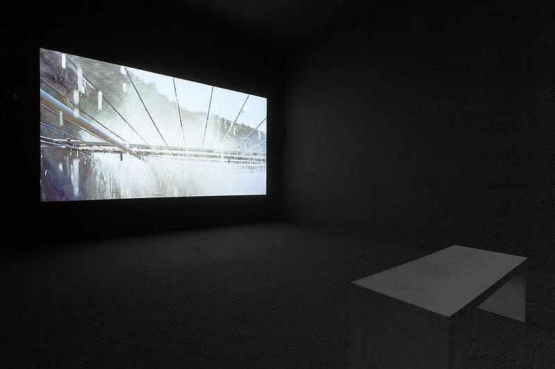 bench in front of a video projection