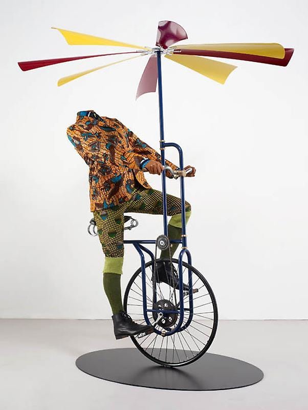 headless mannequin riding a flying machine