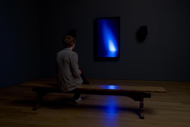 person looking at the blue light