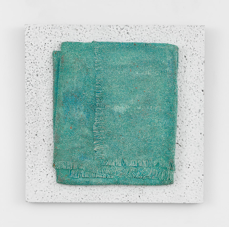 Image of an untitled 2023 artwork by Michelle Grabner made of Lava stone, bronze, and oil