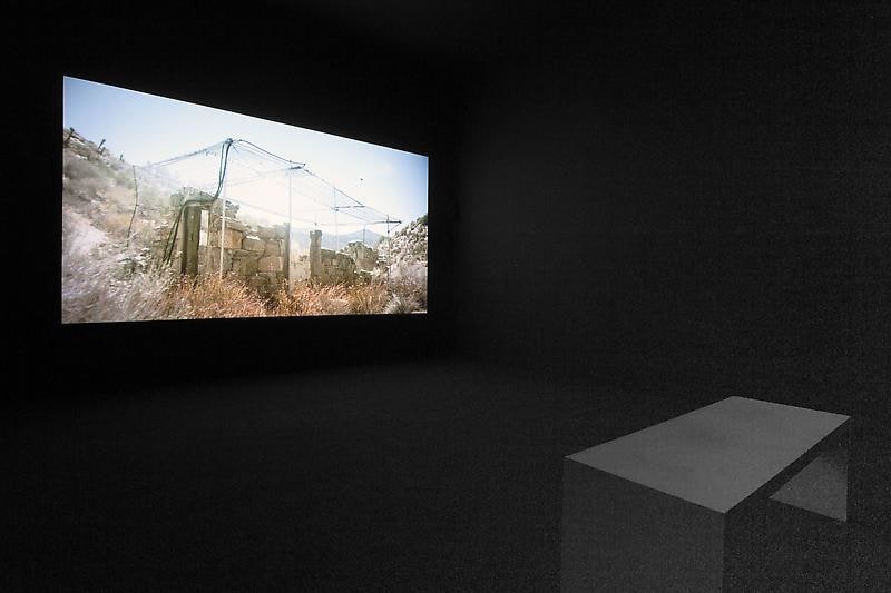 bench in front of a video projection