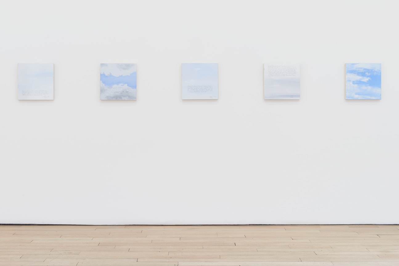 installation view of several square canvases in a row