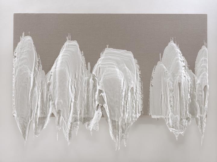 linen with strokes of thick, dried, white paint dangling from it