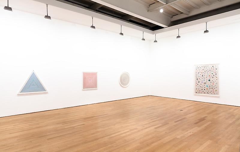 exhibition view of four artworks