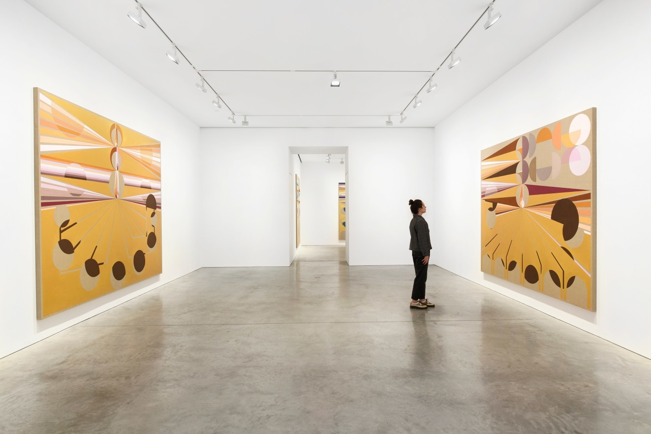 gallery with two artworks with a entry way leading to another room