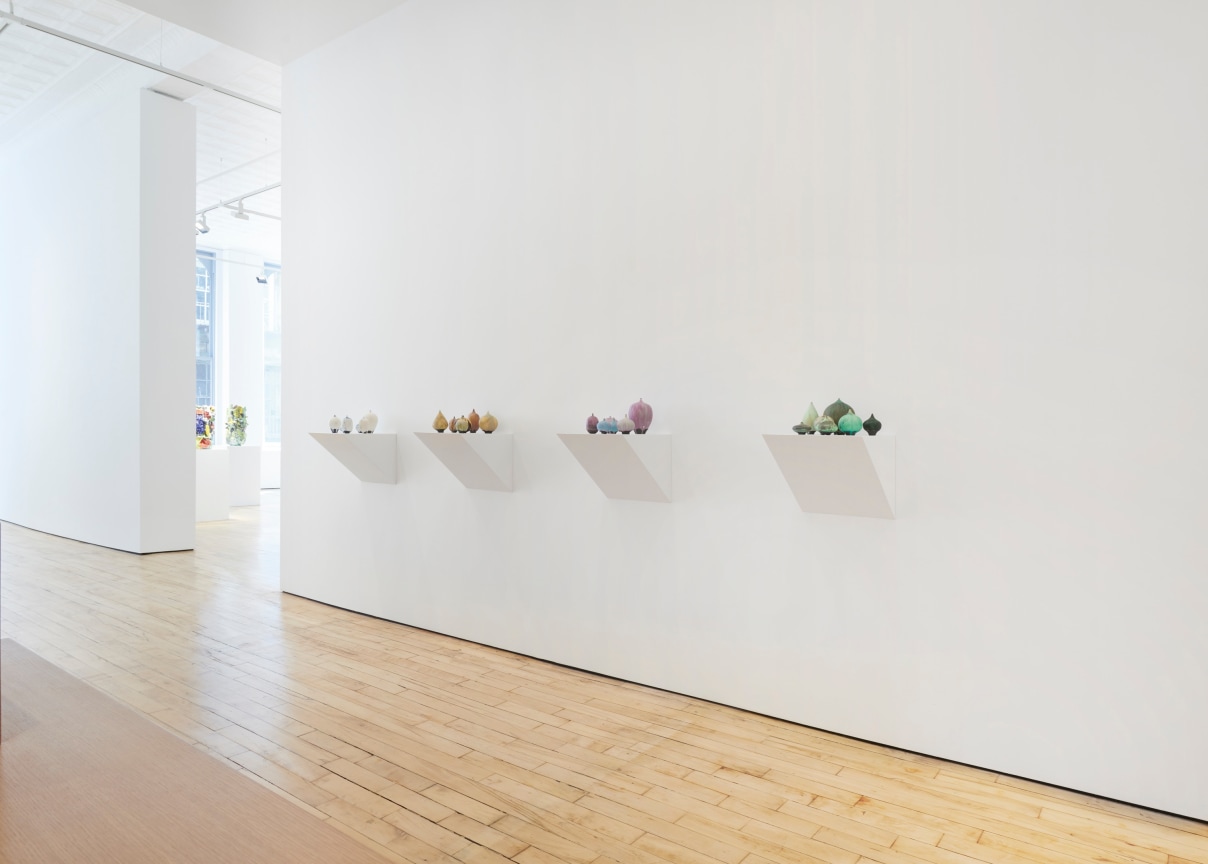 several small sculptures on pedestals