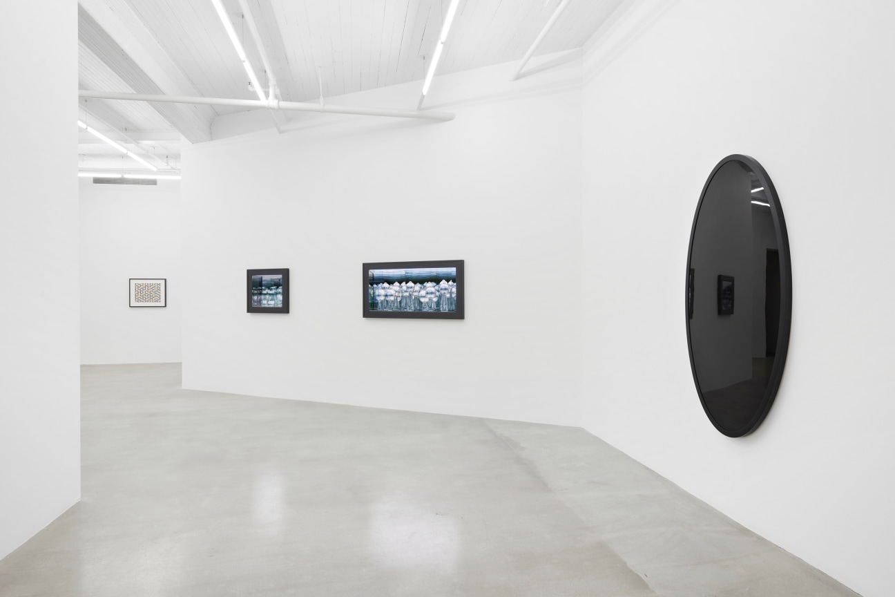 view of a gallery hallway with artworks on the walls