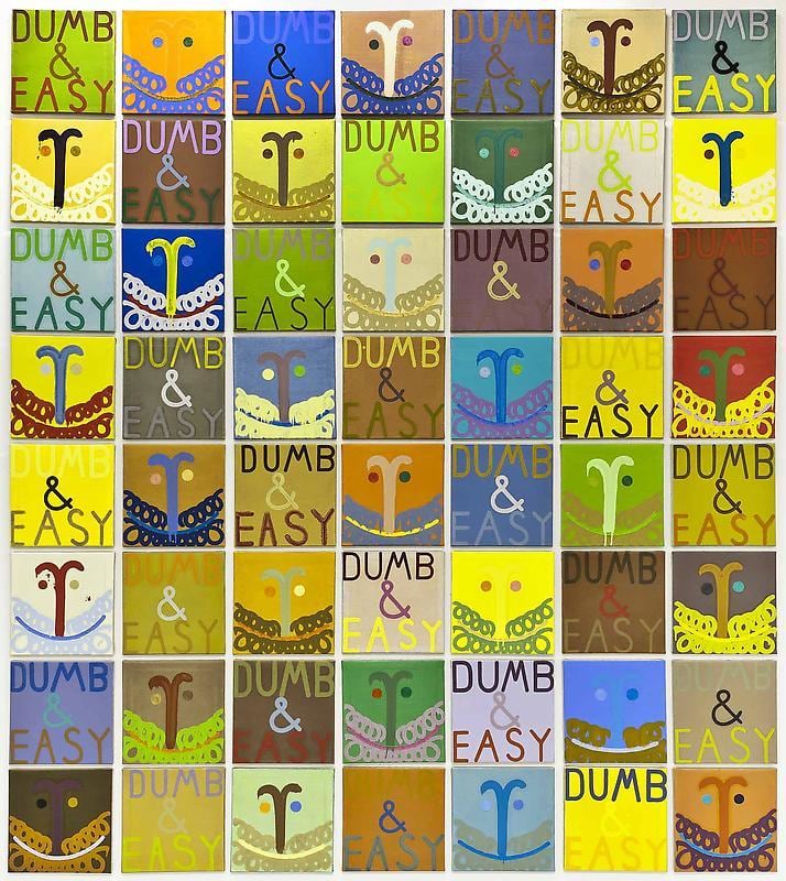 several small paintings of what resemble happy faces