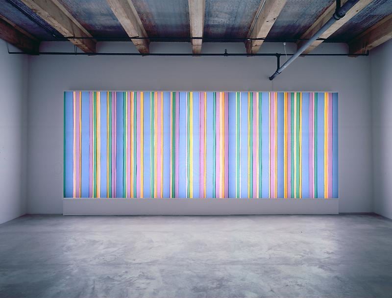 Fluorescent light box with laminated filters