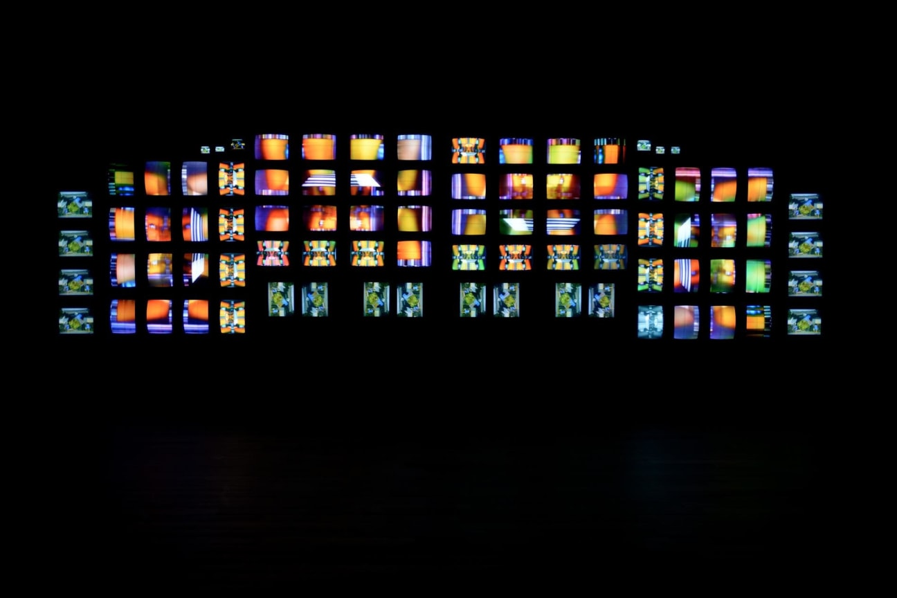 installation view of multiple TV screens