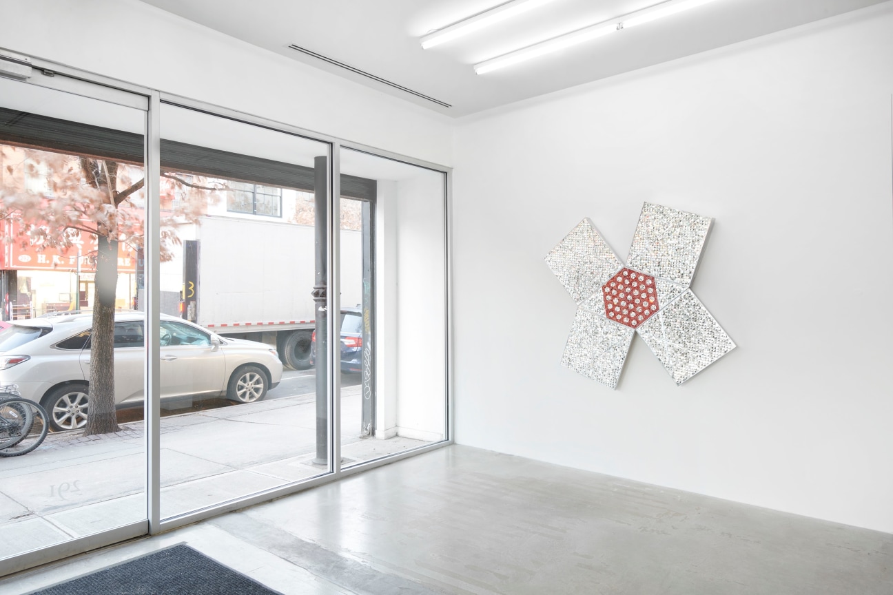 glass artwork next to a window viewing towards the street