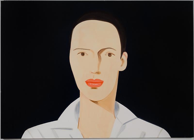 man with brown eyes and large lips looking at the viewer
