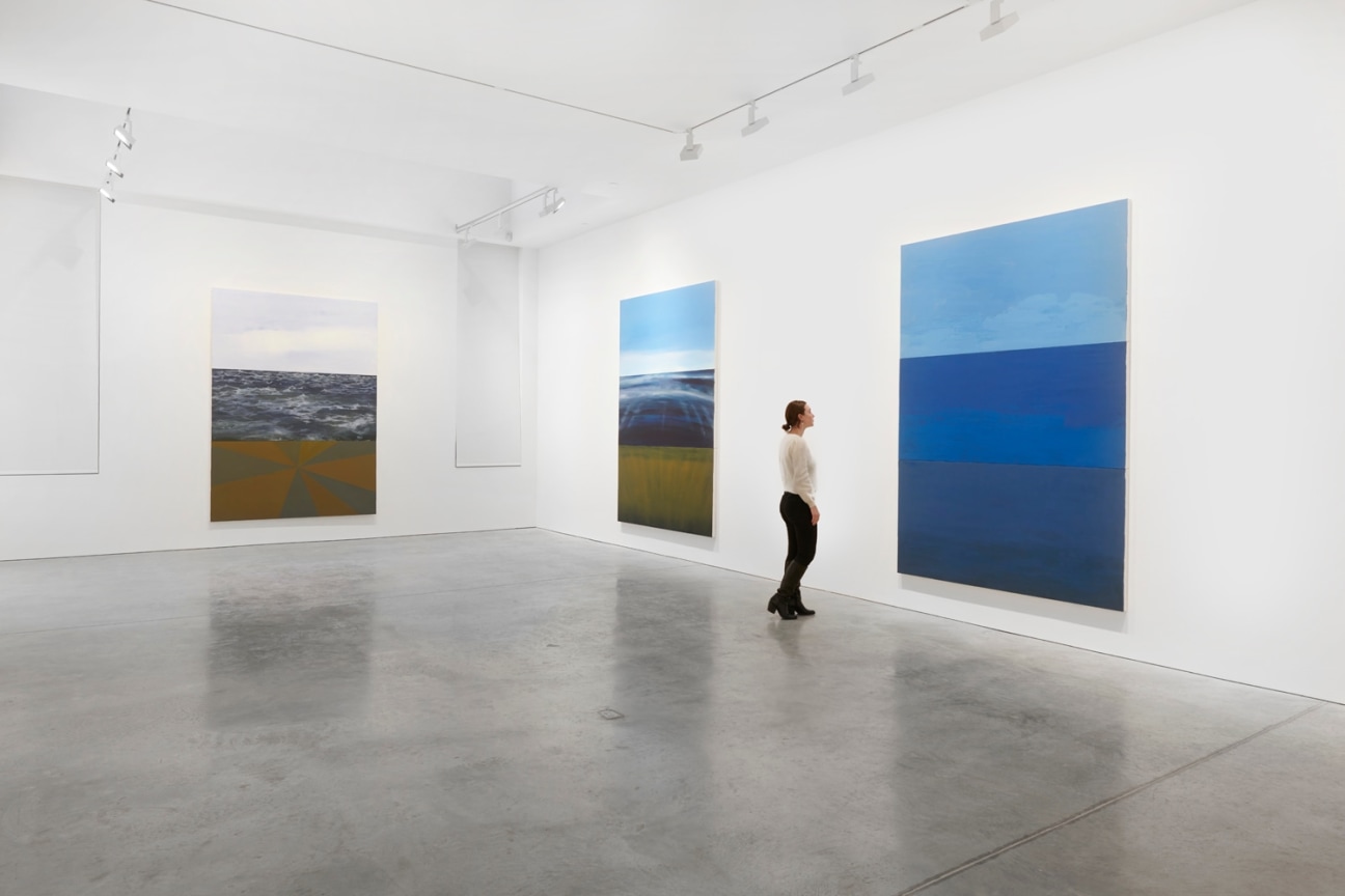 person looking at a painting