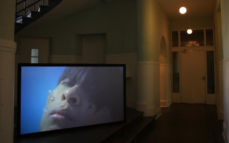 image of a video still of a man that appears to be underwater