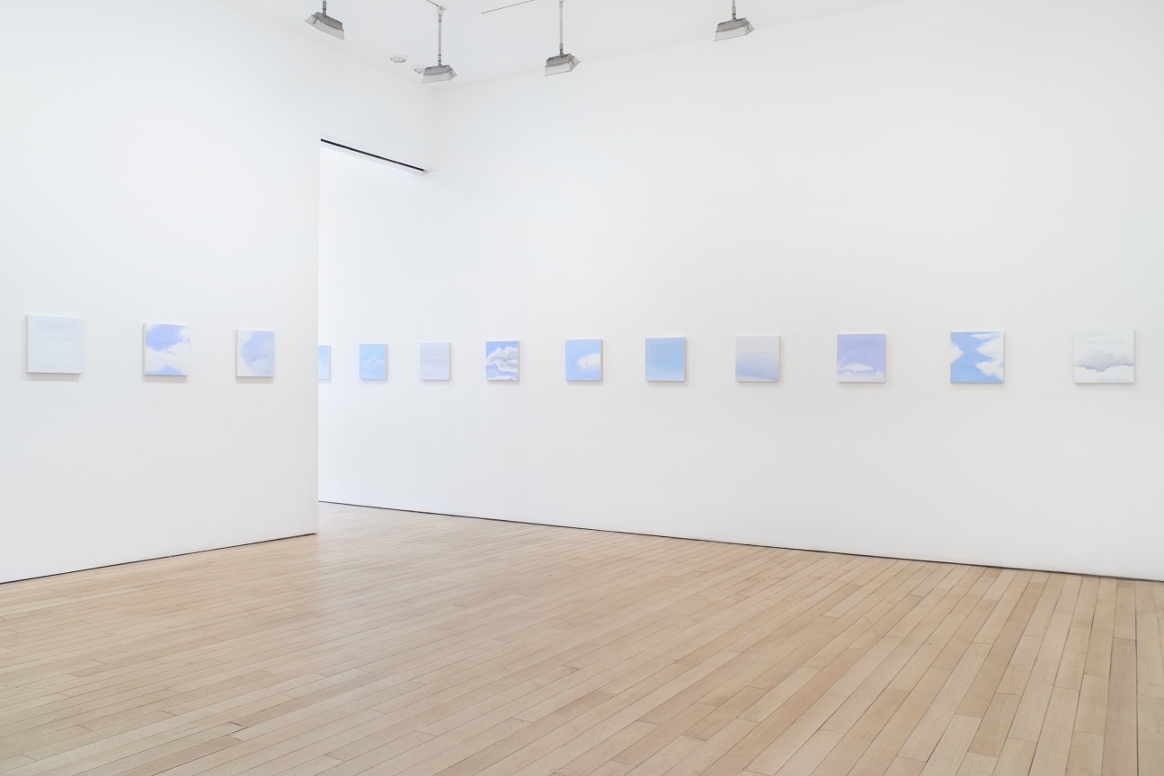 installation view of several square canvases in a row