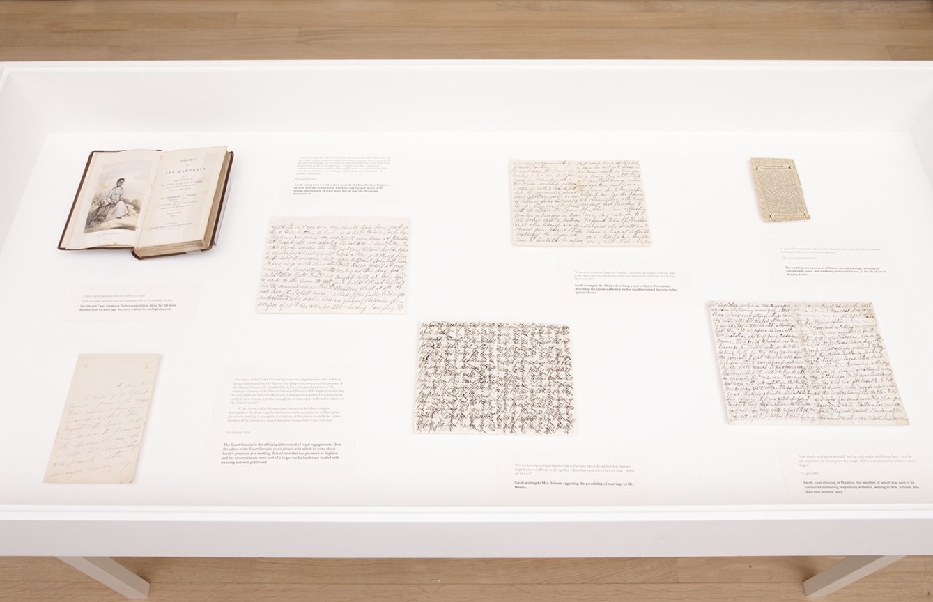 display case with old documents