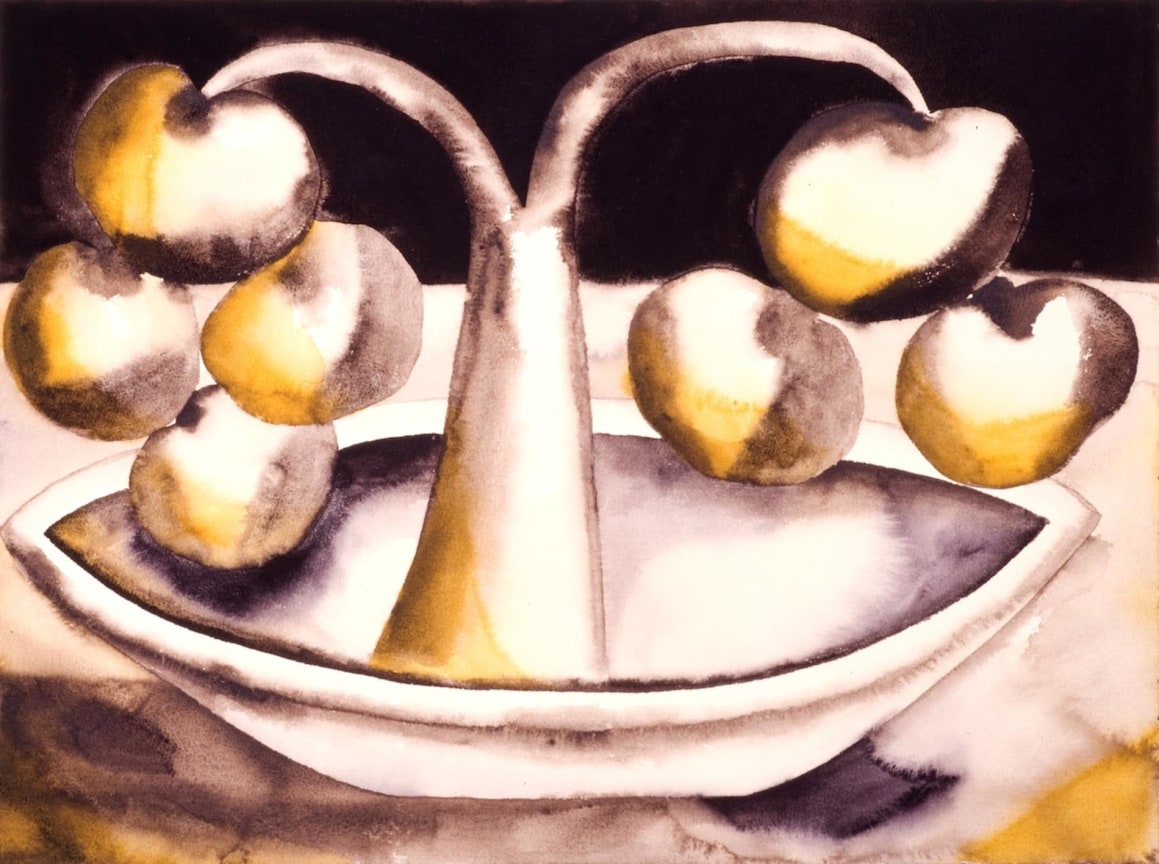 plant in a bowl bearing yellow fruit