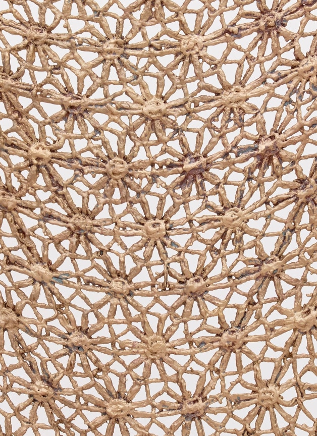 close up of a bronze sculpture imitating knitted fabric