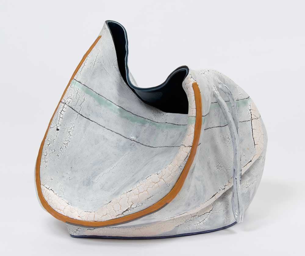 Caved-in clay pot with baby blue glaze by Kathy Butterly.