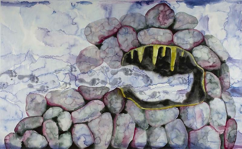 footprints headed into a cave