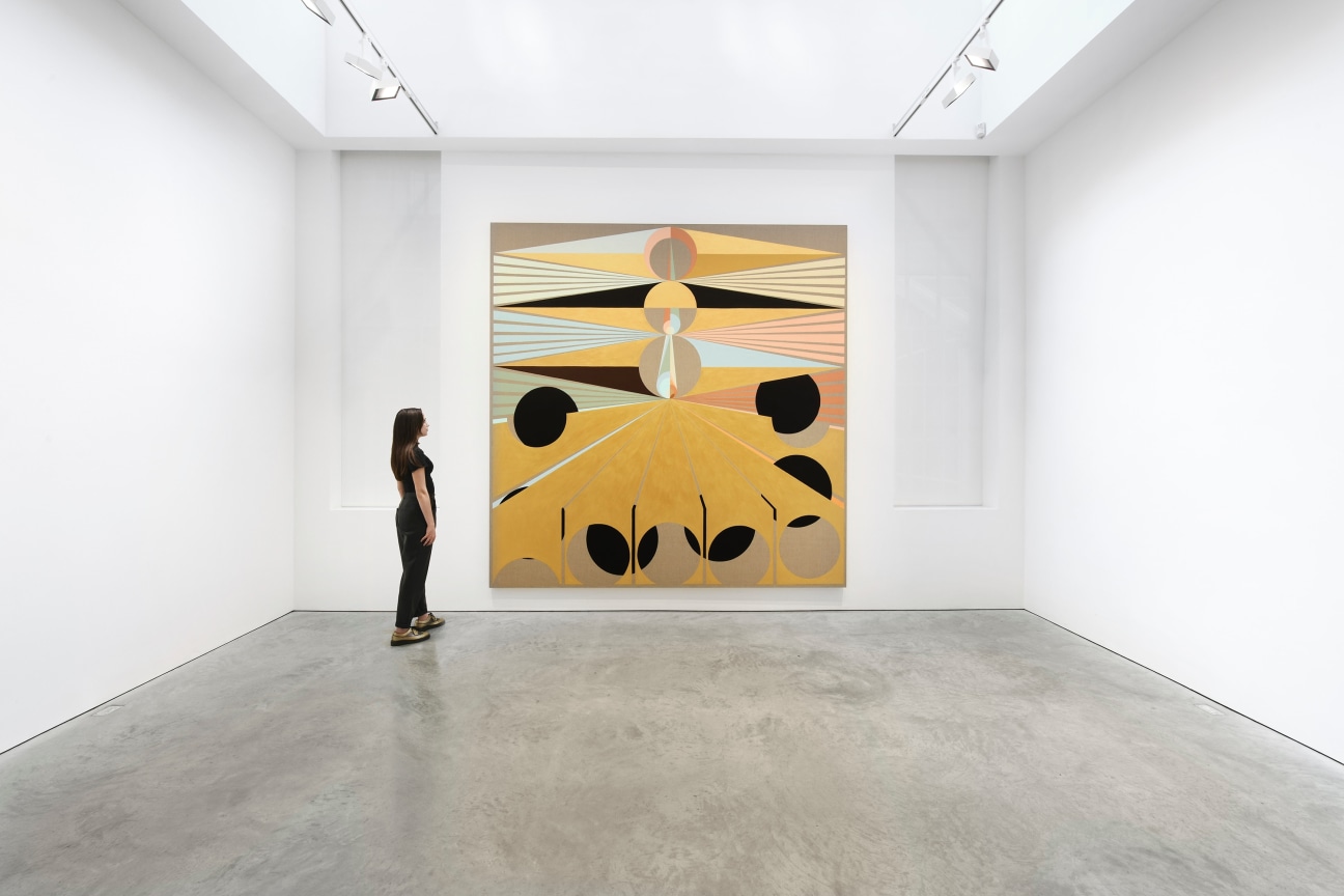 person looking at a painting