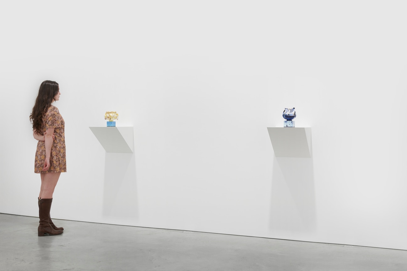 person viewing one of two artworks