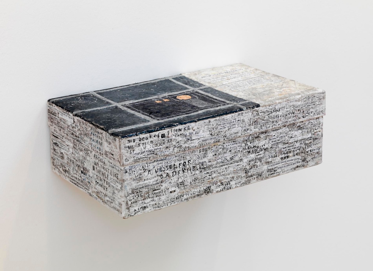 Shoebox covered with writing and scribbles attached to a wall by SIMON EVANS&trade;.