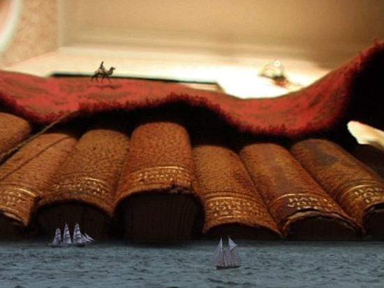 drapery, books, and water edited in to create a landscape similar to a desert