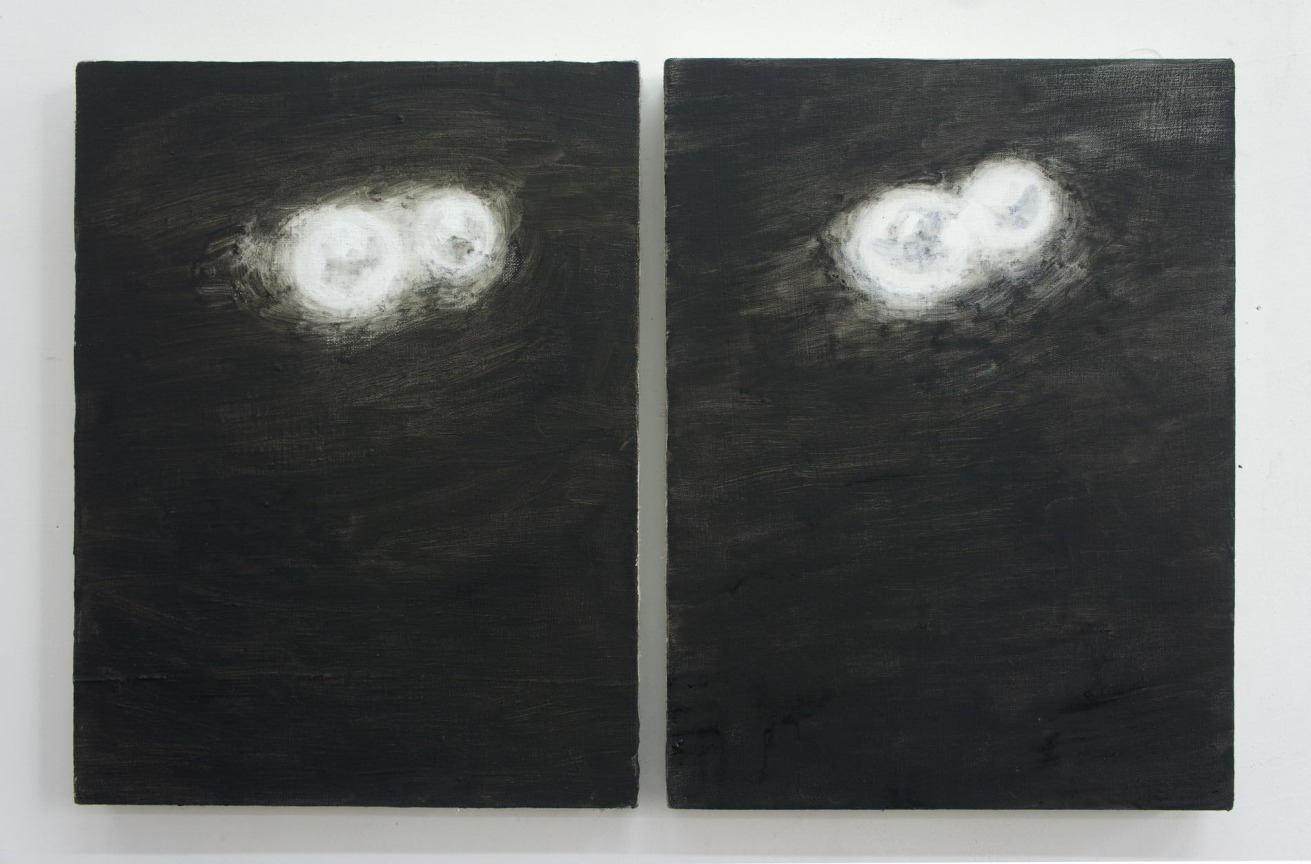 two paintings of two glowing, white beads each against a black backdrop