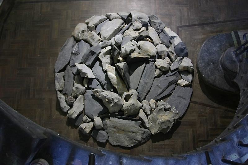 rocks on the floor piled together in a circle